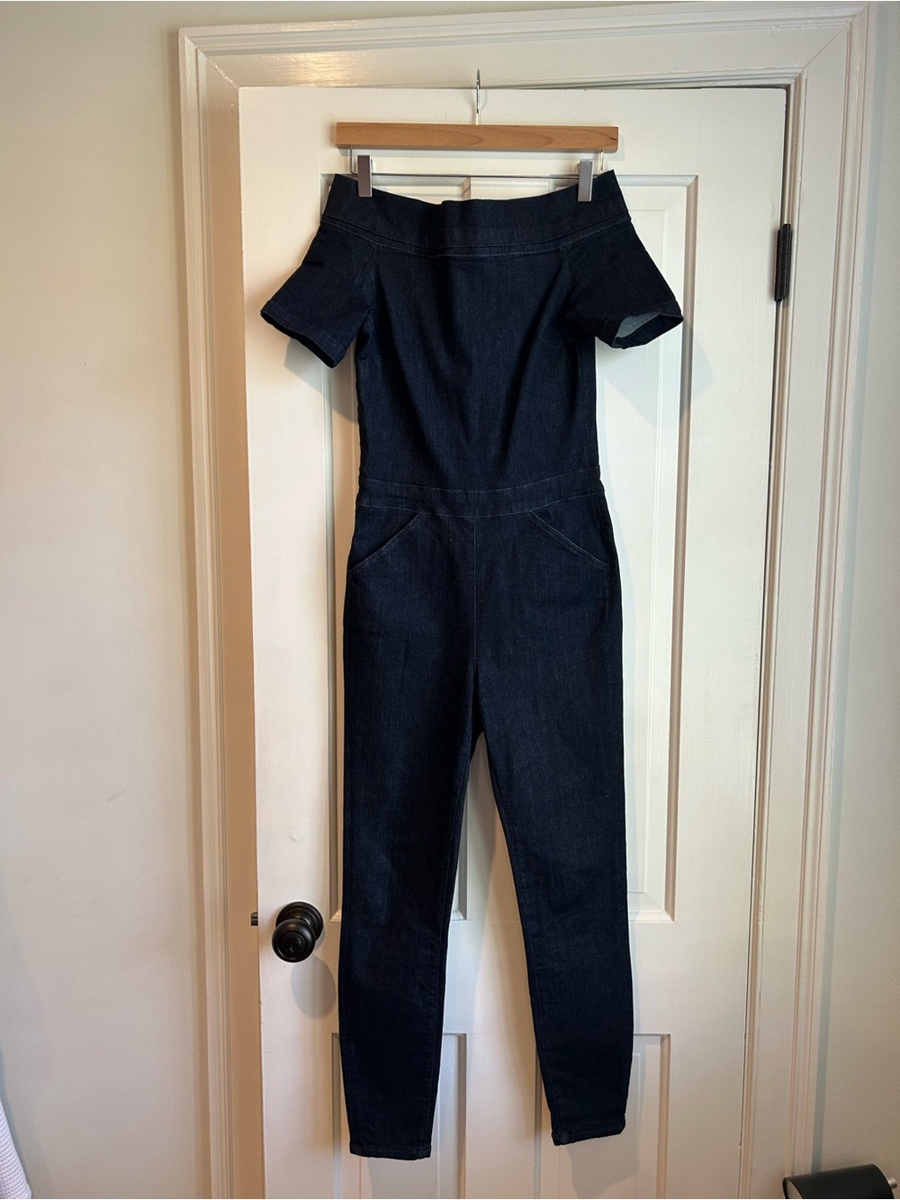 Dark denim off the shoulder jumpsuit.